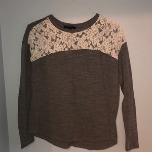Grey light sweater with white lace.